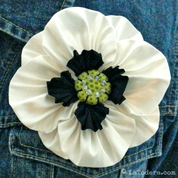 Fabric flower store pins and brooches